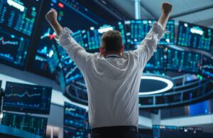 AI Stock to Double Down Person raising both fists in the air.
