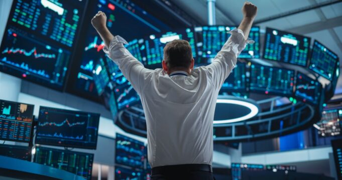 AI Stock to Double Down Person raising both fists in the air.